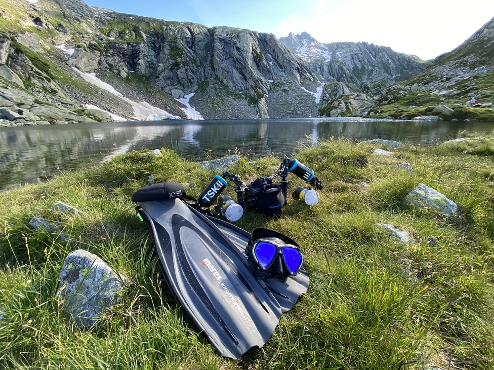 Mountain scenery, mountain lake, fins and photo equipment